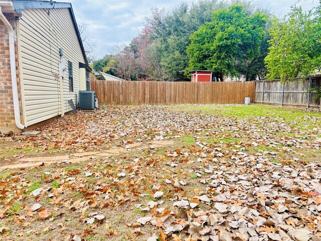 view of yard with central AC unit