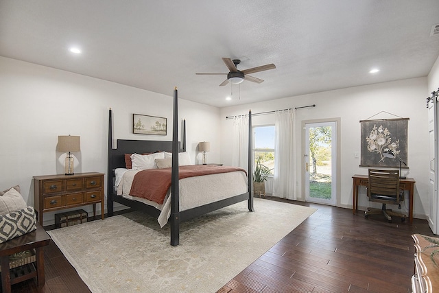 bedroom featuring dark hardwood / wood-style flooring, access to outside, and ceiling fan