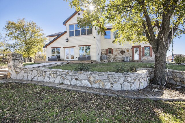 rear view of property with french doors