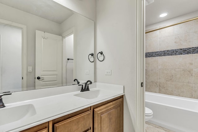 bathroom featuring tile patterned floors, vanity, and toilet