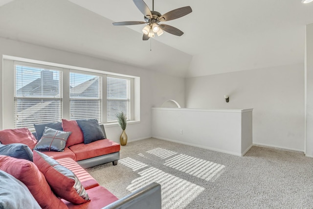 carpeted living room featuring ceiling fan and lofted ceiling