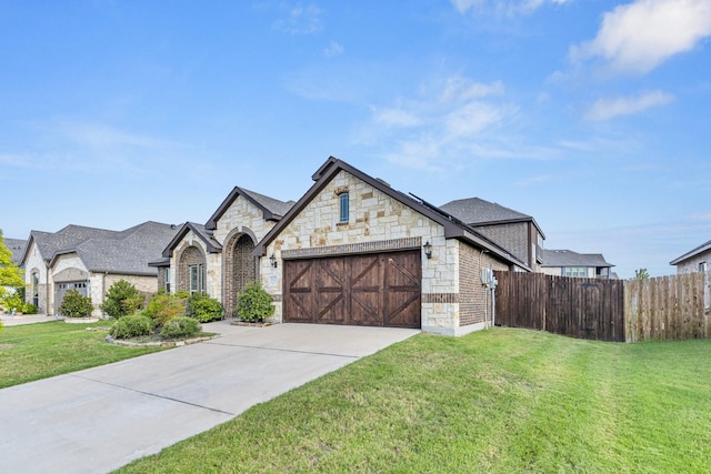 french country style house with a garage and a front yard