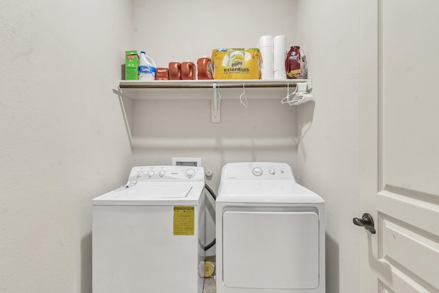 washroom featuring washer and dryer