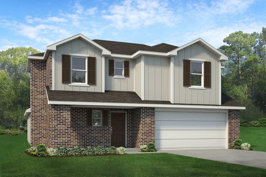 view of front of house featuring a garage and a front lawn