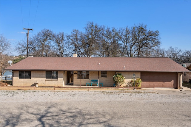 ranch-style house featuring a garage