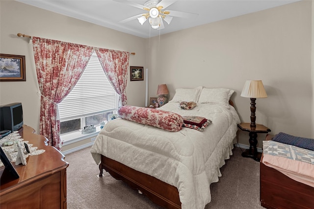 bedroom featuring ceiling fan and carpet