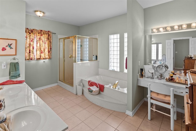 bathroom with tile patterned floors, plus walk in shower, and vanity