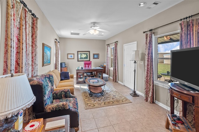 tiled living room featuring ceiling fan