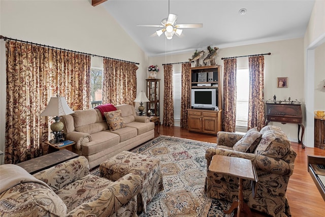 living room with light hardwood / wood-style flooring, high vaulted ceiling, and ceiling fan