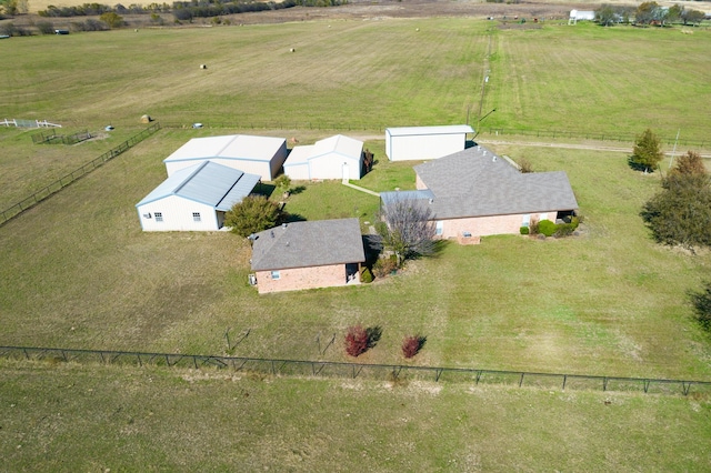 birds eye view of property with a rural view