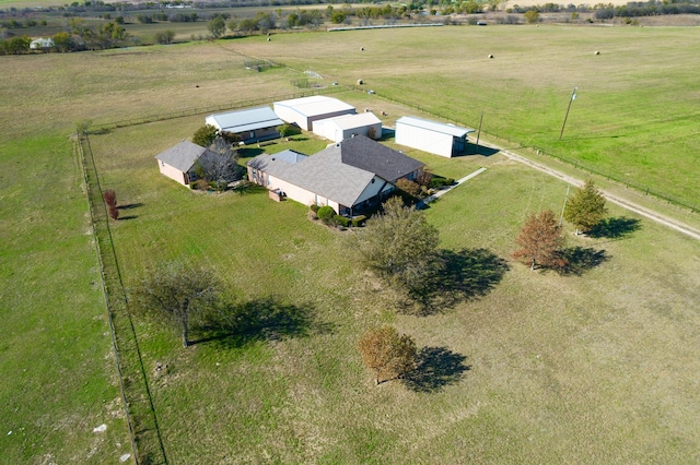 birds eye view of property with a rural view