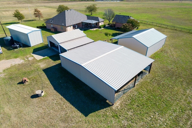 birds eye view of property with a rural view