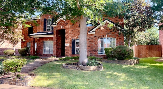 front facade with a front yard