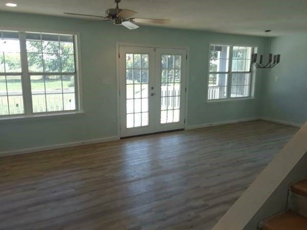 entryway featuring french doors, ceiling fan, and dark hardwood / wood-style flooring