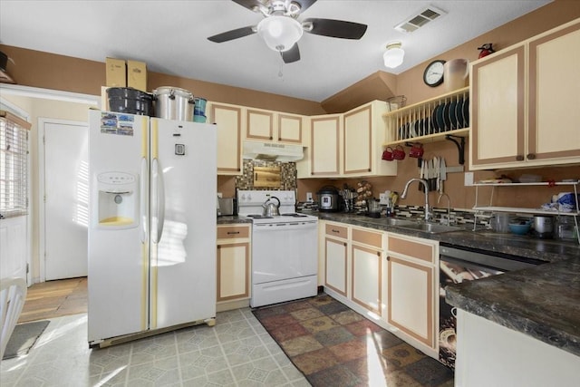 kitchen featuring ceiling fan, sink, and white appliances