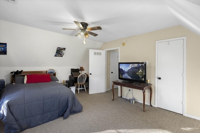 bedroom featuring ceiling fan, carpet floors, and vaulted ceiling