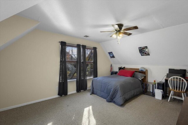 carpeted bedroom featuring ceiling fan and lofted ceiling