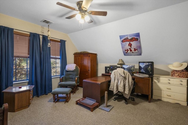 carpeted home office featuring ceiling fan and lofted ceiling