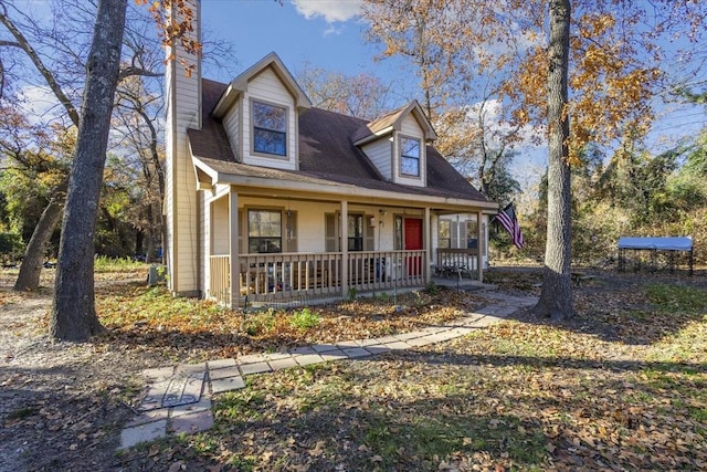 cape cod home with a porch