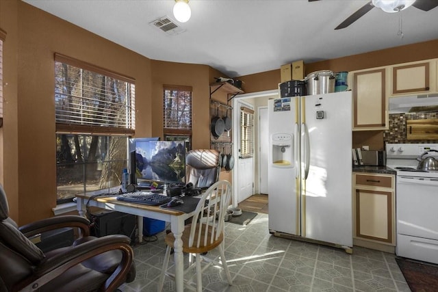 kitchen with white appliances and ceiling fan