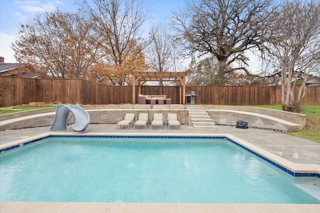 view of swimming pool featuring a pergola, a fenced backyard, a water slide, and a fenced in pool