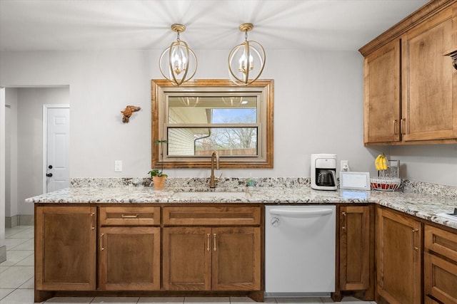 kitchen featuring light stone counters, an inviting chandelier, dishwasher, a sink, and brown cabinetry
