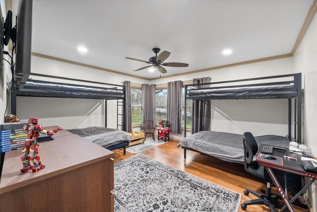 bedroom featuring ceiling fan, ornamental molding, wood finished floors, and recessed lighting