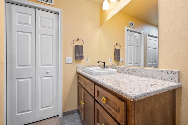 bathroom featuring tile patterned floors and vanity