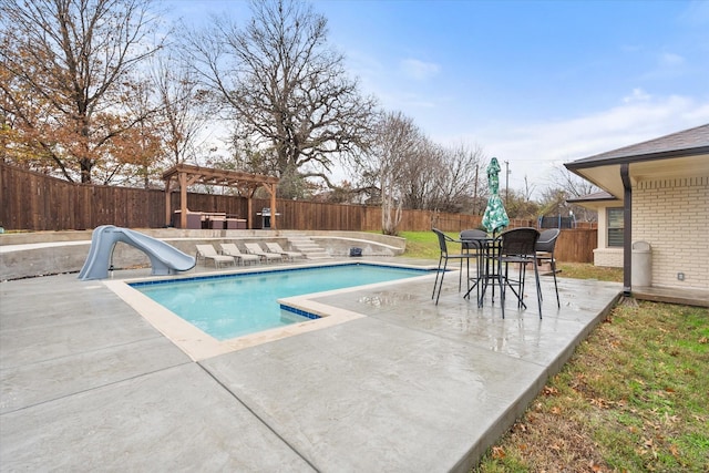 view of pool featuring a pergola, a patio area, a fenced backyard, a fenced in pool, and a water slide