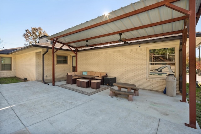 view of patio with outdoor lounge area and ceiling fan