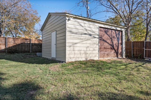 view of outbuilding with a yard