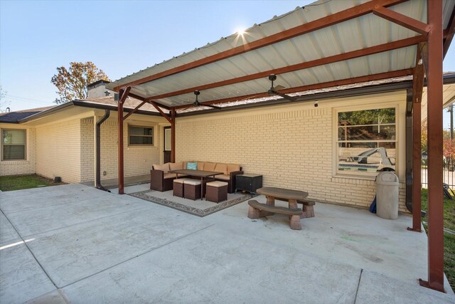 view of patio with outdoor lounge area and ceiling fan