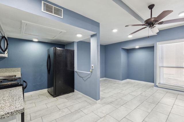 kitchen featuring black appliances and ceiling fan