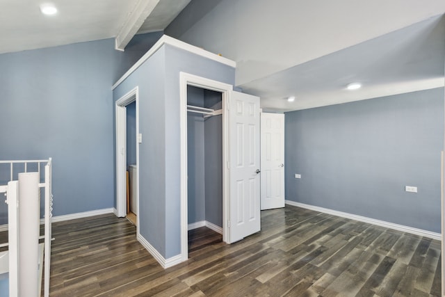 unfurnished bedroom featuring a closet and dark hardwood / wood-style floors