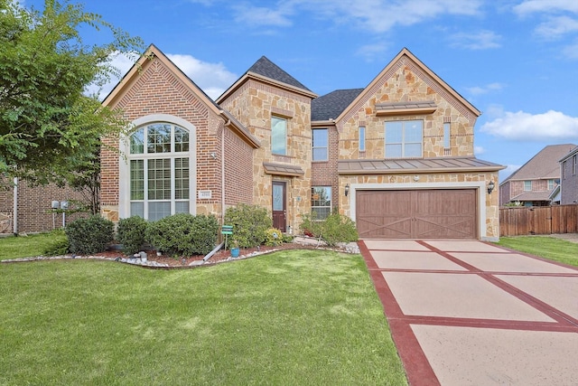 view of front of house featuring a front yard and a garage