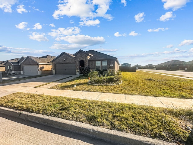 view of front of home featuring a mountain view, a garage, and a front lawn