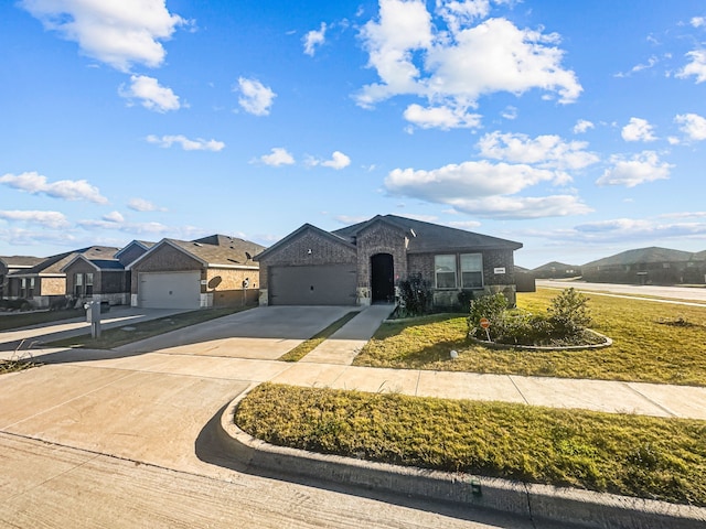 view of front of property featuring a mountain view and a garage