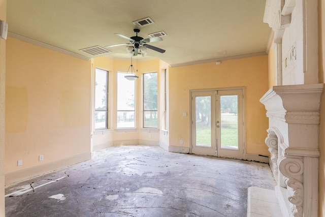 spare room featuring a high end fireplace, ceiling fan, and ornamental molding