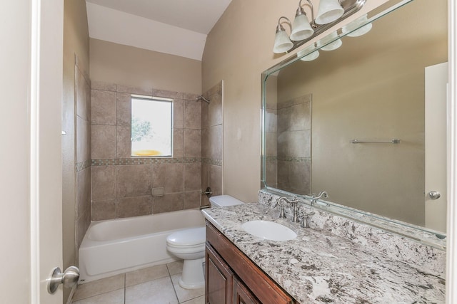 full bathroom with tile patterned floors, vanity, vaulted ceiling, toilet, and tiled shower / bath