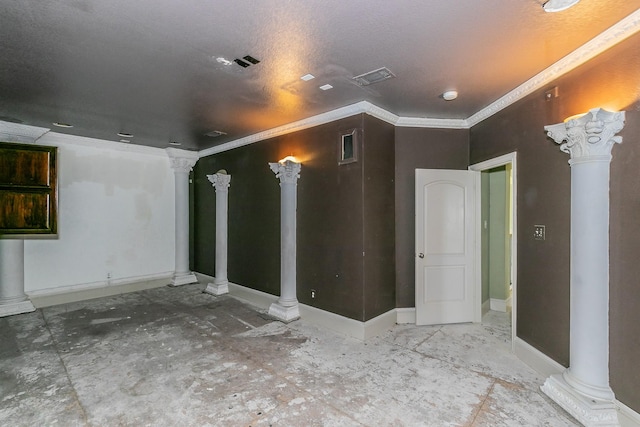 interior space featuring a textured ceiling, ornate columns, and crown molding