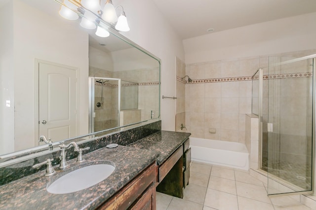 bathroom with tile patterned flooring, vanity, and plus walk in shower