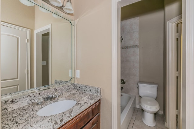 bathroom featuring tile patterned flooring, vanity, and toilet