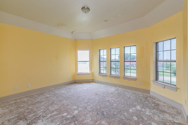 unfurnished room featuring a healthy amount of sunlight