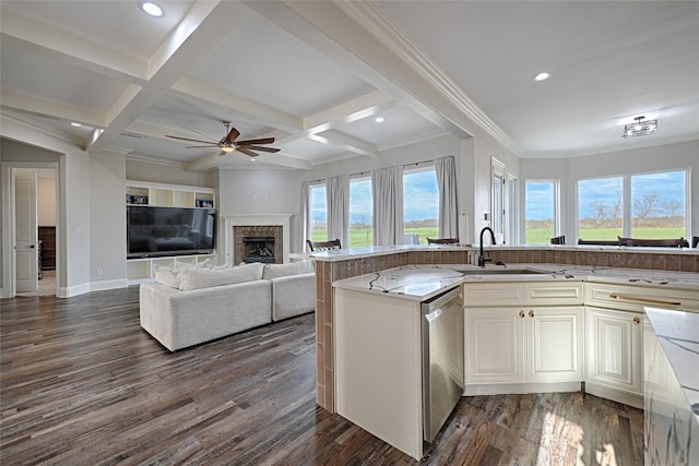 kitchen with dark hardwood / wood-style floors, dishwasher, sink, and beam ceiling