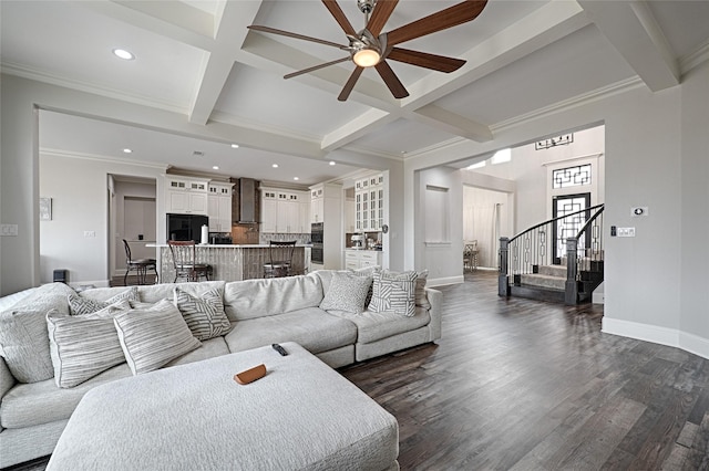 living room with beam ceiling, coffered ceiling, and dark hardwood / wood-style flooring