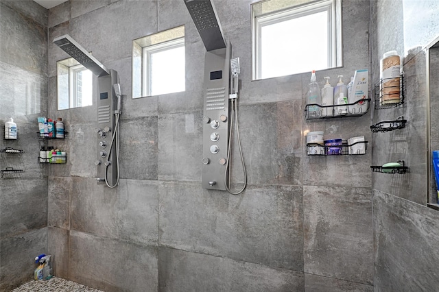 bathroom featuring a tile shower