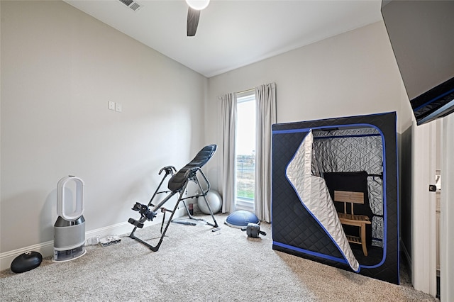 exercise room featuring carpet and ceiling fan