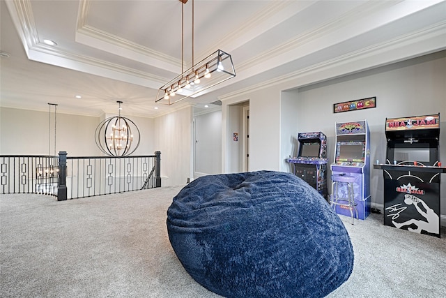 living area featuring an inviting chandelier, crown molding, a raised ceiling, and carpet floors