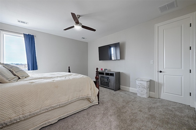 bedroom with light carpet and ceiling fan