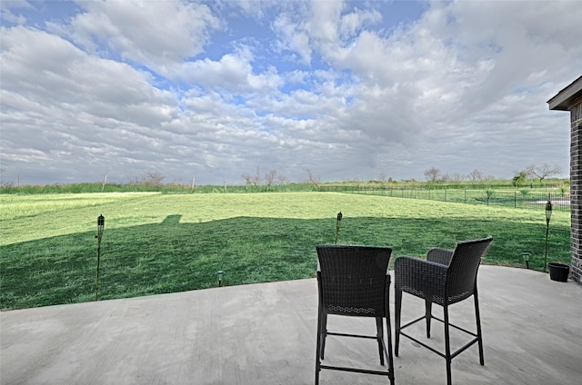 view of patio / terrace with a rural view